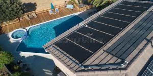 How can solar panels be used to keep an indoor pool cool? 